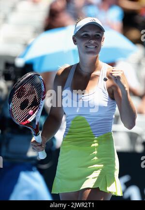 Caroline Wozniacki of Denmark celebrates a point against Shahar Peer of