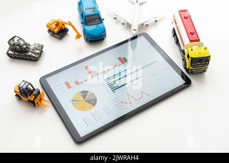 Tablet computer with different types of toy transport. auto center Stock Photo