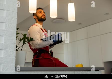 Portrait of an electrician using his tablet computer Stock Photo