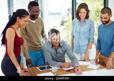 The dream works with teamwork. a group of architects in the boardroom. Stock Photo