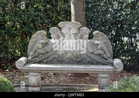Bench decorated with angel figures in Italy Stock Photo