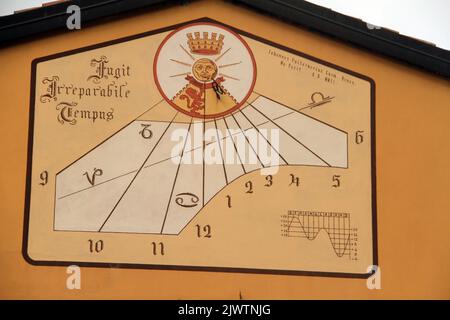 Sundial on the face of a building in Italy Stock Photo