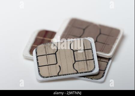 Smartphone sim card pile macro close up view isolated Stock Photo