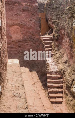 Narrow passages between rock-cut churches in Lalibela, Ethiopia Stock Photo