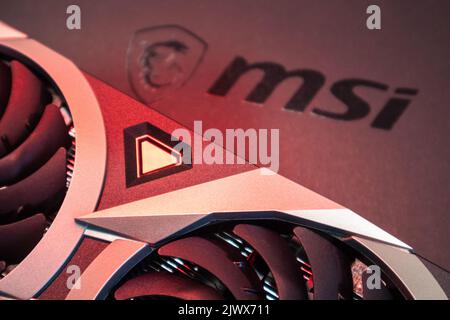 Kyiv, Ukraine - August 19, 2022: MSI graphics video card in red light, close-up with selective focus Stock Photo