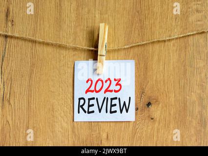 2023 Review Symbol White Paper With Words 2023 Review Clip On Wooden Clothespin Beautiful Wooden Background Business And 2023 Review Concept Copy 2jwx9bt 