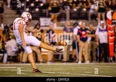 Winston-Salem, NC, USA. 1st Sep, 2022. Virginia Military Institute Keydets place kicker Jack Culbreath (41) punts the ball during the second quarter of the NCAA football match up at Truist Field in Winston-Salem, NC. (Scott Kinser/CSM). Credit: csm/Alamy Live News Stock Photo