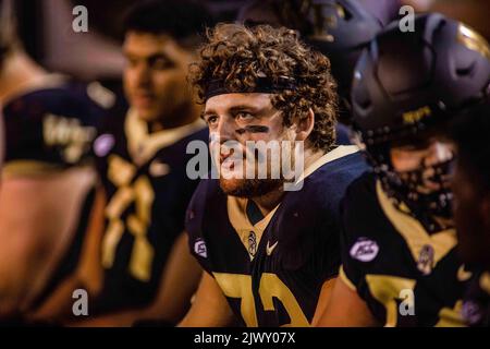 Winston-Salem, NC, USA. 1st Sep, 2022. Wake Forest Demon Deacons defensive lineman Tyler Williams (72) rests on the bench during the fourth quarter of the NCAA football match up at Truist Field in Winston-Salem, NC. (Scott Kinser/CSM). Credit: csm/Alamy Live News Stock Photo