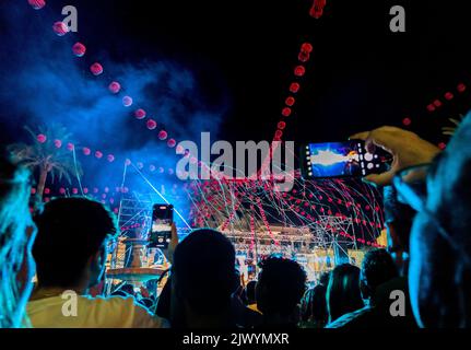 Live music performance decorated with paper lanterns and streamers. Backlight public view Stock Photo