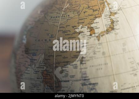 Close up of Mongolia, China and India on a spinning geographical physical globe. Earth model on a stand. High quality photo Stock Photo