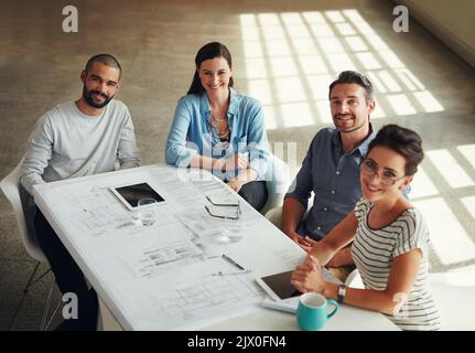 Youll never be disappointed with them on the job. a group of designers using a digital tablet in their meeting. Stock Photo
