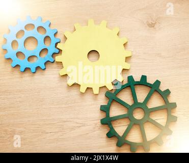 Settings gear icon, abstract and illustration of cog wheel against a wooden background. Innovation, development and mechanical logo. Setup, engine and Stock Photo