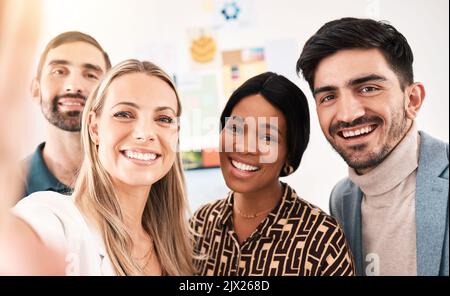Creative, corporate and happy team taking a selfie on a phone in office conference room. Portrait of business employee friends taking a picture Stock Photo