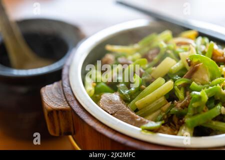 angle view fast food of fried pork and fish with celery with bowl of soup horizontal composition Stock Photo