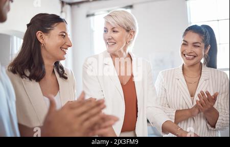 Team success, collaboration and teamwork of a office work group celebration of project completion. Diversity of professional business woman with a Stock Photo