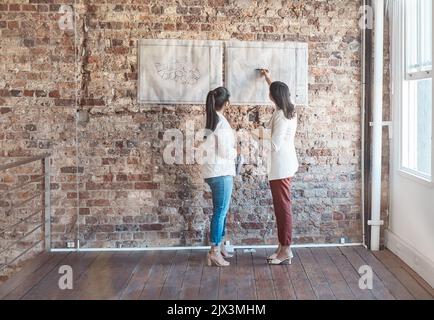 Creative designer, architect and engineer in meeting for construction plan, drawing on blueprint for home renovation and design discussion in office Stock Photo