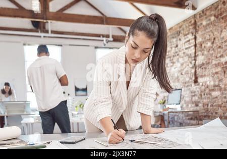 Architecture, young woman and designer planning building blueprint, construction project and property development in startup agency. Engineering work Stock Photo
