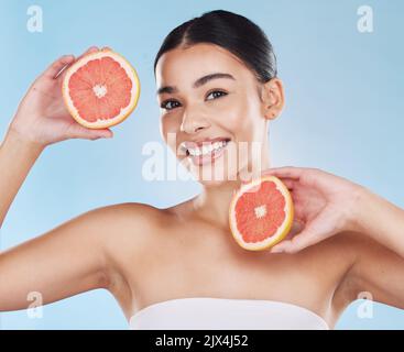 Grapefruit, skincare, face and diet wellness keeps her happy and healthy for skin healthcare, eat healthy fruit with nutrition. Portrait of a beauty Stock Photo
