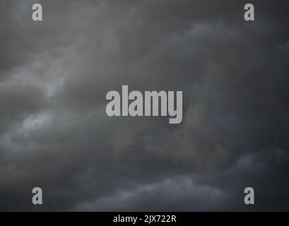 gray sky and black clouds on a rainy day during the rainy season Stock Photo