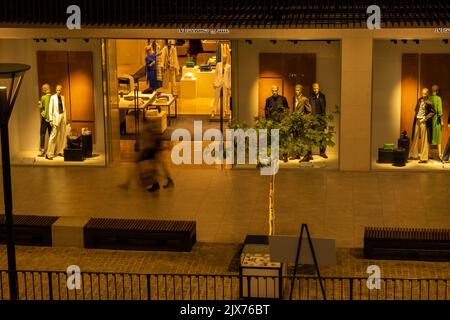 Gdansk Poland - April 2022. Forum gallery shopping mall view of the interior of the building at night. Modern shopping and entertainment centre. Architecture in the city center of Gdansk is the historical capital  Stock Photo