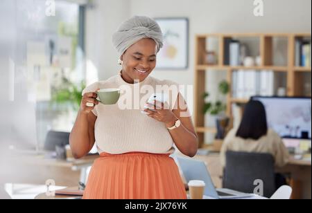 Girl on office coffee break with phone texting, internet or web search and relax in startup business or company. Black woman working in social media Stock Photo