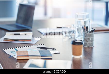 Desk, empty office workspace on a wooden desk or table in a corporate boardroom. Laptop or computer in a digital marketing agency or IT company with Stock Photo