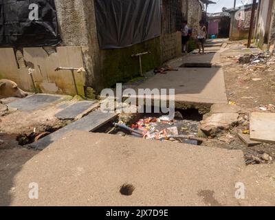 Mumbai, Maharashtra / India – March 2, 2020 : Open gutter sewer line in slum area of Mumbai, India. Stock Photo