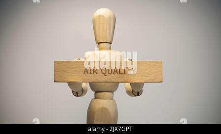 Air quality written on wooden surface. Close-up in the studio. social issues Stock Photo
