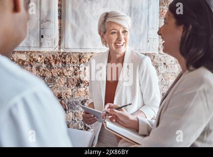 Laughing, funny and happy business people having a meeting and making a silly joke while planning ideas and talking about a strategy. Leadership Stock Photo