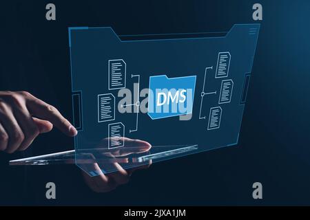 Document management system or DMS. Organizes documents and files. Person touches hologram and virtual tablet. Stock Photo