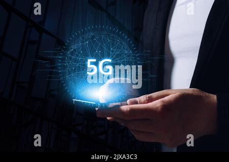Technology of international modern networks 5G. Hologram above the tablet in the hands of a person. Stock Photo