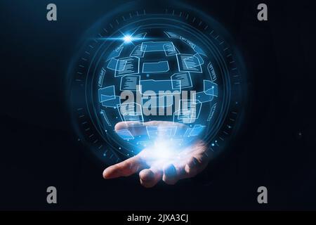 Document management system or DMS. Cloud storage with handling folders and files. hologram over a person hand Stock Photo