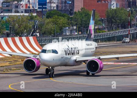 Mexico City, Mexico - April 14, 2022: Volaris Airbus A320neo airplane at Mexico City airport (MEX) in Mexico. Stock Photo