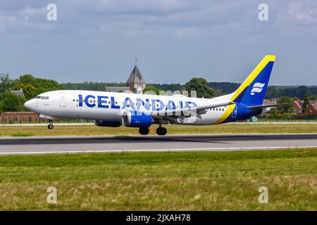 Brussels, Belgium - May 21, 2022: Icelandair Boeing 737 MAX 8 airplane at Brussels airport (BRU) in Belgium. Brussels, Belgium - May 21, 2022: Icelandair Boeing 737 MAX 8 airplane at Brussels airport (BRU) in Belgium.