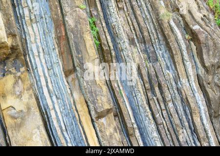 Different geological layers exposed that form a mountain on Mount Igeldo, San Sebastian, Spain Stock Photo