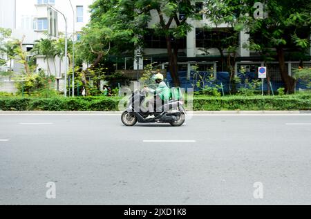 Lumphini, THAILAND - August 26, 2022 : Motorcycle deliveries running fast on the road area lumphini in Bangkok, Thailand. Stock Photo