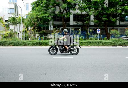 Lumphini, THAILAND - August 26, 2022 : Motorcycle deliveries running fast on the road area lumphini in Bangkok, Thailand. Stock Photo