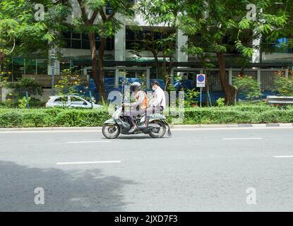 Lumphini, THAILAND - August 26, 2022 : Motorcycle deliveries running fast on the road area lumphini in Bangkok, Thailand. Stock Photo