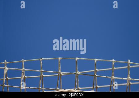 Detail of an old metal grid with sky to sky leaving copy space above for your texts Stock Photo