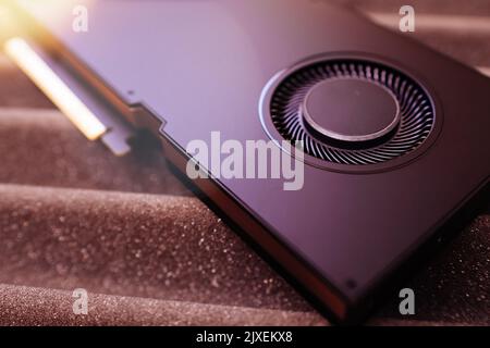 New powerful GPU professional video card on tech background - upgrade to more powerful ai video processor Stock Photo