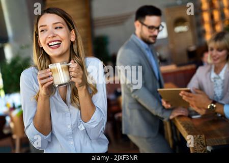 Business colleagues having conversation during coffee break Stock Photo