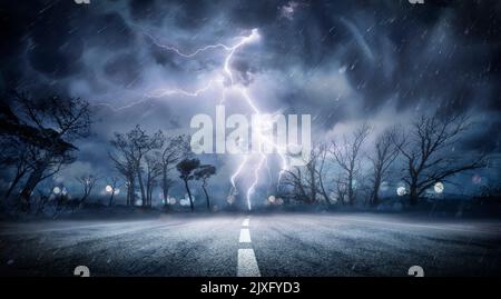 Lightning Thunderstorm Flash In The Storm On Road - Weather Concept Stock Photo