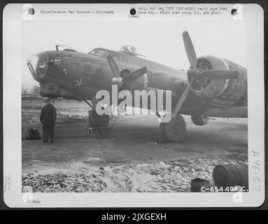 Crew Chief Stands By The Boeing B-17 'Flying Fortress' 'Morning Star' Of The 615Th Bomb Squadron, 401St Bomb Group At An 8Th Air Force Base In England, 21 January 1945. Stock Photo