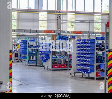 Assembly shop in production. Plant for manufacture of lighting devices. Stock Photo