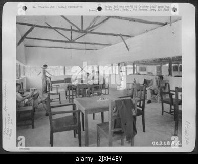 Officers Of The 436Th Bomb Squadron, 7Th Bomb Group, Relax In Their Recreation Room Where Various Types Of Indoor Games And Reading Are Available. Bishnupur, India. August 1943. Stock Photo