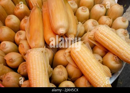 corn on the cob cooked in a metal basket Stock Photo