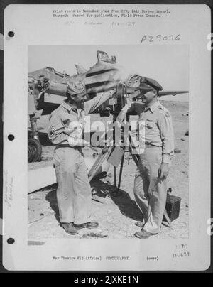 Lt. Francis J. Burgess, (left) of 716 N. Irving Ave., Los Angeles, Calif., and Lt. Harold A. Bollerman, formerly of the News of the Day newsreel, of 508 Prospect Ave., Ridgefield, N.J. are pictured above after having photographed methods employed by Stock Photo