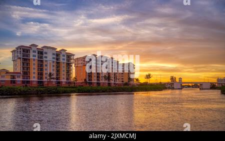 Sunset sky behind buildings along the Gulf Intracoastal Waterway in Venice Florida USA Stock Photo