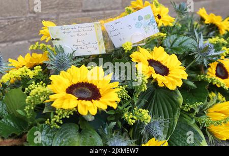 Flowers at Dunfermline Crematorium ahead of the funeral service of Rab Wardell. Wardell died after suffering a cardiac arrest while lying in bed with his partner, Olympic cyclist Katie Archibald, on August 23, days after winning the Scottish MTB XC Championships. Picture date: Wednesday September 7, 2022. Stock Photo