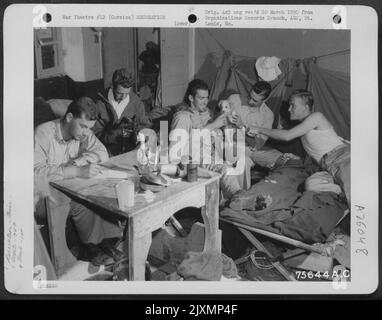 Members of the 94th Fighter Squadron, 1st Fighter Group relax in their quarters at an air base in Corsica. Stock Photo